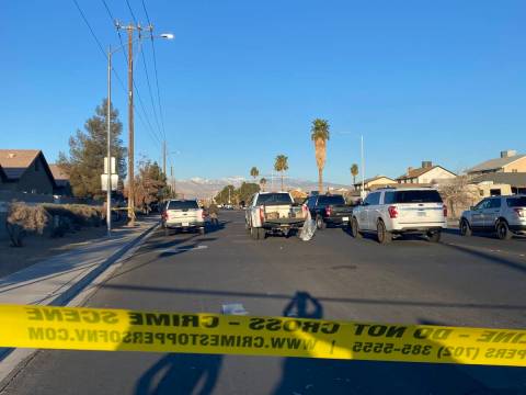 Las Vegas police investigate a fatal crash at the intersection of Gowan and Walnut roads in the . 